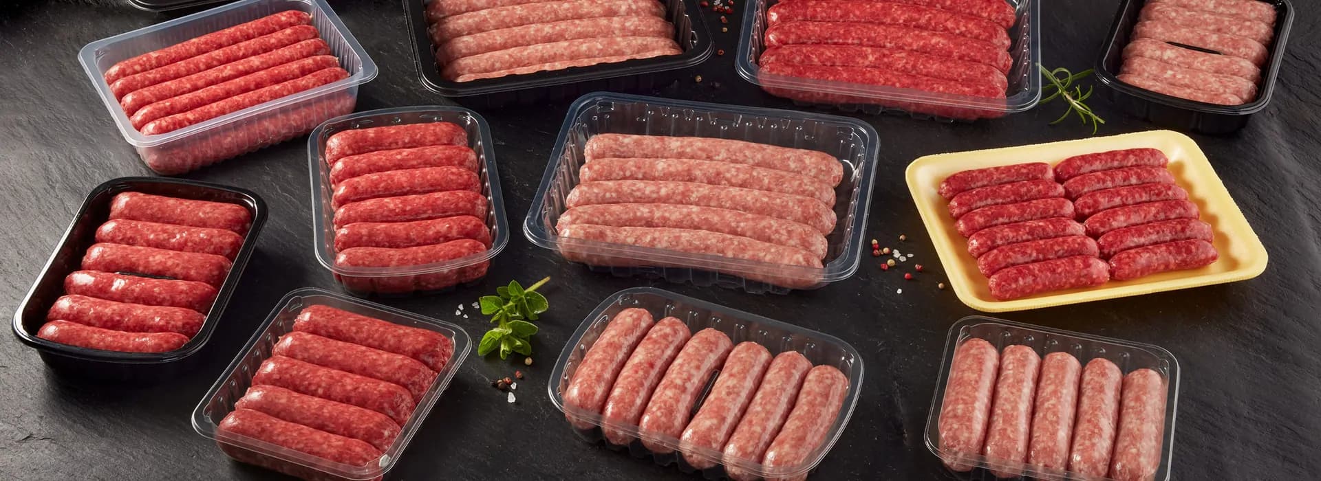 Trays of fresh sausages