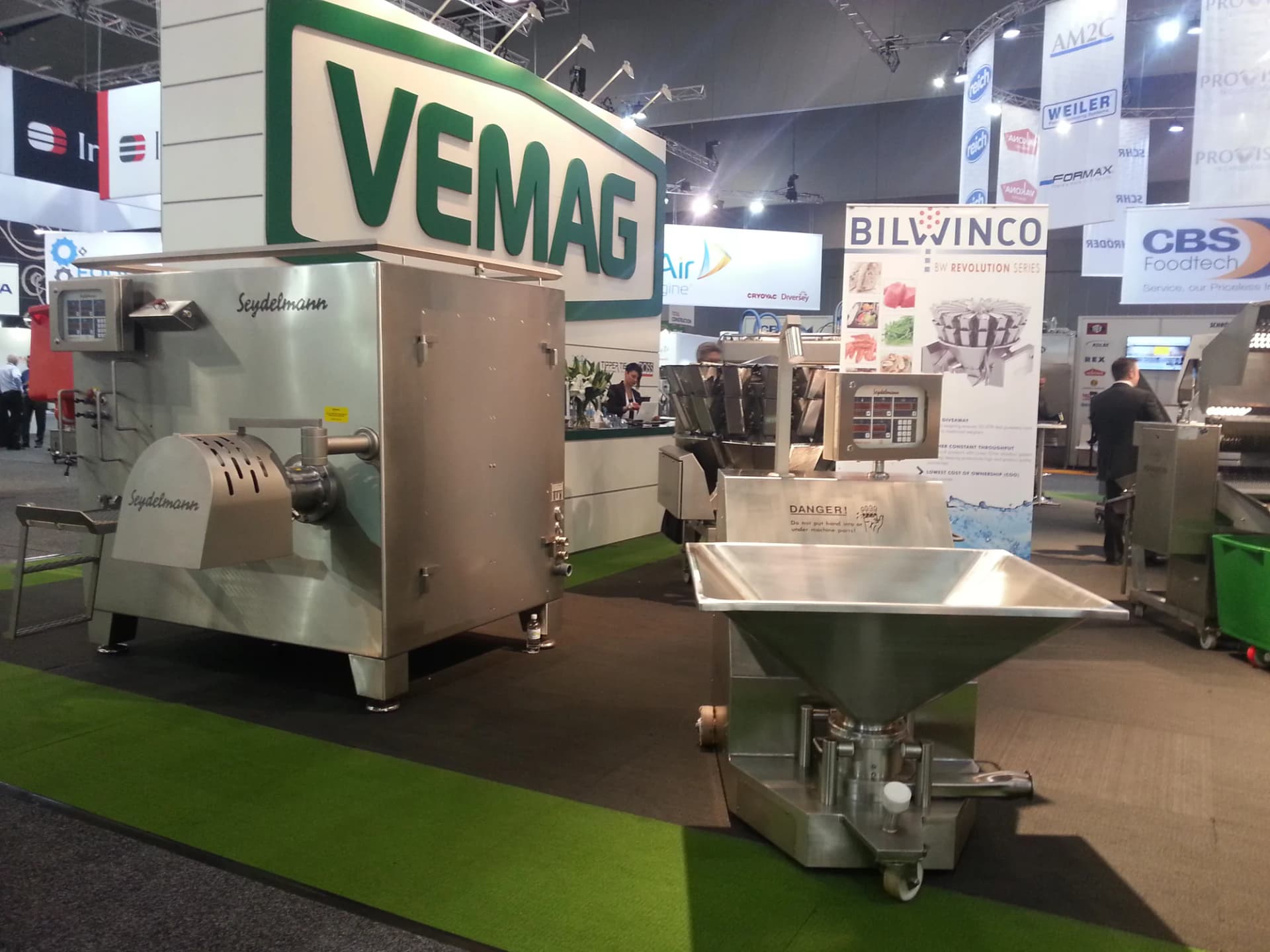 Grinder on display under a VEMAG sign