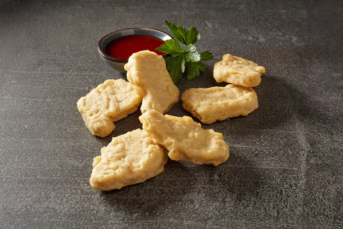Plant-based nuggets with dipping sauce