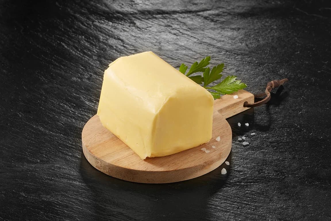 Block of butter on a board