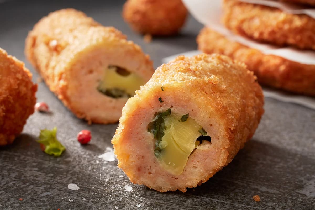 Filled crumbed rolls cut open